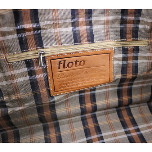 The Floto Parma Duffle Bag is a leather weekender that is handcrafted in Italy with our famous Parma leather. Parma leather is tanned in a special way with no chemicals so the bag will get better as it ages - each travel bag takes on a unique look and darkens like a saddle over time. Parma is leather tanning the natural way. 6